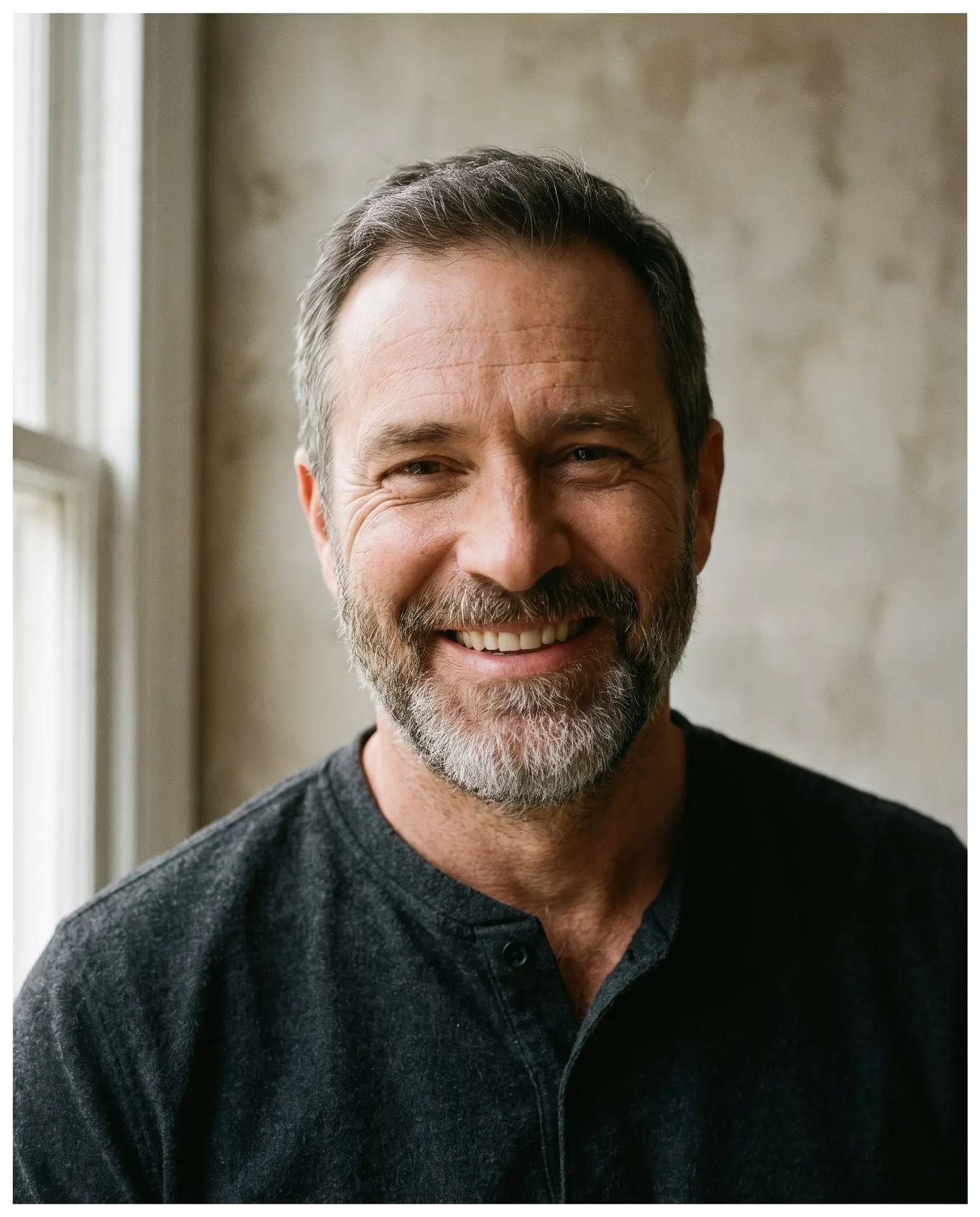 Man in his forties smiling after complete restoration